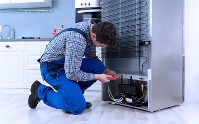 Technician servicing appliance